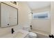 Contemporary bathroom with a stylish vanity, framed mirror, and a shower-tub combo at 9324 Pecky Cypress Way, Orlando, FL 32836