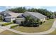 Charming home with mature landscaping, a well-manicured lawn, and an attached two-car garage at 9324 Pecky Cypress Way, Orlando, FL 32836