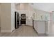 Bright kitchen featuring white cabinets, stainless steel appliances, and granite countertops at 9324 Pecky Cypress Way, Orlando, FL 32836