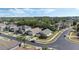 A beautiful street view shows a neighborhood with well-manicured lawns, mature trees, and various home styles at 9324 Pecky Cypress Way, Orlando, FL 32836