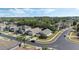 A beautiful street view shows a neighborhood with well-manicured lawns, mature trees, and various home styles at 9324 Pecky Cypress Way, Orlando, FL 32836