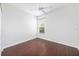 Inviting bedroom with hardwood floors, a ceiling fan, and natural light from the window at 9651 Old Marsh Ct, Orlando, FL 32832