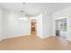 Open living room featuring tile floors, white walls, and natural light at 9651 Old Marsh Ct, Orlando, FL 32832
