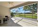 Enclosed patio features ample space for outdoor dining, with a serene pond view at 9651 Old Marsh Ct, Orlando, FL 32832