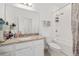Well-lit bathroom features granite counters, a soaking tub, and a shower at 9790 Amber Chestnut Way, Winter Garden, FL 34787