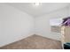 Clean bedroom with neutral carpet and a window at 9790 Amber Chestnut Way, Winter Garden, FL 34787