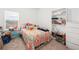 Cozy bedroom featuring a large window and ample storage at 9790 Amber Chestnut Way, Winter Garden, FL 34787