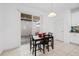 Dining area with sliding glass door to outdoor space and adjacent kitchen at 9790 Amber Chestnut Way, Winter Garden, FL 34787