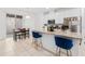 Modern kitchen featuring a center island with bar seating and white cabinets at 9790 Amber Chestnut Way, Winter Garden, FL 34787