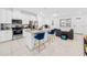 Open-concept kitchen with white cabinetry, granite countertops, and stainless steel appliances at 9790 Amber Chestnut Way, Winter Garden, FL 34787
