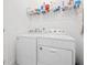Functional laundry room with modern appliances and ample counter space at 9790 Amber Chestnut Way, Winter Garden, FL 34787