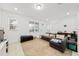 Cozy living room featuring a sectional sofa and ample natural light at 9790 Amber Chestnut Way, Winter Garden, FL 34787