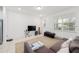 Bright living room with large window and neutral carpeting at 9790 Amber Chestnut Way, Winter Garden, FL 34787