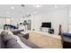 Open living area with a modern design and seamless flow to kitchen at 9790 Amber Chestnut Way, Winter Garden, FL 34787