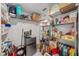 Walk-in pantry with wire shelving, stocked with food items and small refrigerator at 9790 Amber Chestnut Way, Winter Garden, FL 34787
