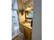 Cozy bathroom with glass-enclosed shower, a vanity, and modern fixtures at 106 Palo Verde Dr, Leesburg, FL 34748