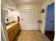 This bathroom features granite counters, tiled floors and ample storage at 106 Palo Verde Dr, Leesburg, FL 34748