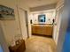 Spacious bathroom with double sinks, granite countertop, and ample cabinet space at 106 Palo Verde Dr, Leesburg, FL 34748