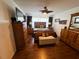 Spacious bedroom with hardwood floors, king bed, and natural light at 106 Palo Verde Dr, Leesburg, FL 34748