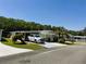 Nice single-story home with well-kept landscaping, a carport, and an inviting entrance at 106 Palo Verde Dr, Leesburg, FL 34748