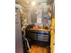 Organized garage space with storage cabinets and tool organizers and pegboards at 106 Palo Verde Dr, Leesburg, FL 34748