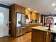 This kitchen boasts wooden cabinetry and modern stainless steel appliances at 106 Palo Verde Dr, Leesburg, FL 34748