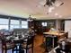 A cozy living area showcases comfortable seating and a dining space connected to a modern kitchen island at 106 Palo Verde Dr, Leesburg, FL 34748