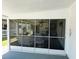 Enclosed back patio with plenty of seating at 106 Palo Verde Dr, Leesburg, FL 34748