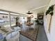 Enjoy outdoor living in this home's screened patio with ample seating at 106 Palo Verde Dr, Leesburg, FL 34748
