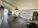 Enclosed back patio with plenty of seating and natural light at 106 Palo Verde Dr, Leesburg, FL 34748