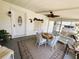 Enjoy outdoor living in this home's screened patio with ample seating and decor at 106 Palo Verde Dr, Leesburg, FL 34748