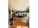 Bright sunroom with hardwood floors, natural light, and music space at 106 Palo Verde Dr, Leesburg, FL 34748