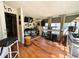 Bright sunroom with hardwood floors, natural light, and music space at 106 Palo Verde Dr, Leesburg, FL 34748