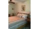 A cozy bedroom featuring a full-sized bed and neutral decor at 1104 Illinois Ave, St Cloud, FL 34769