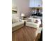 Bright living room with cozy seating, modern decor, and stylish flooring at 1104 Illinois Ave, St Cloud, FL 34769
