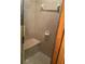 Bathroom shower featuring built-in bench and tiled walls at 1104 Illinois Ave, St Cloud, FL 34769