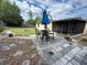 Backyard with patio, outdoor seating, lush lawn, storage shed, and landscaped features at 120 Borada Rd, Sanford, FL 32773
