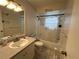 Bathroom featuring a vanity, toilet, and shower-tub combo with a curtain at 120 Borada Rd, Sanford, FL 32773