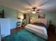Comfortable bedroom with ceiling fan and artwork; a relaxing retreat at 120 Borada Rd, Sanford, FL 32773