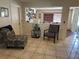 Inviting hallway with tile flooring, calming blue accents, and view to the dining room at 120 Borada Rd, Sanford, FL 32773
