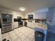 Bright kitchen featuring stainless steel appliances, ample counter space, and tile flooring at 120 Borada Rd, Sanford, FL 32773