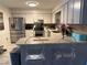 Spacious kitchen with stainless steel appliances, light cabinetry, and a breakfast bar at 120 Borada Rd, Sanford, FL 32773