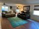 Comfortable living room featuring plush seating, a stylish rug, and ample natural light at 120 Borada Rd, Sanford, FL 32773