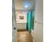 Bright bathroom with a shower-tub combination and a bright blue shower curtain at 121 Bougainvillea Dr, Leesburg, FL 34748