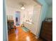 A view of a small bathroom with a shower, vanity and toilet at 121 Bougainvillea Dr, Leesburg, FL 34748