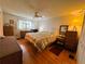Bedroom with neutral tones, a window with shutters, and two dressers at 121 Bougainvillea Dr, Leesburg, FL 34748