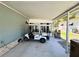 Well-lit carport area with parking and storage space at 121 Bougainvillea Dr, Leesburg, FL 34748