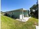 Charming home with blue siding, well-maintained lawn, and tidy landscaping at 121 Bougainvillea Dr, Leesburg, FL 34748