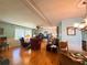 Spacious living room with hardwood floors, comfortable furniture, and good natural light at 121 Bougainvillea Dr, Leesburg, FL 34748