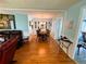 Spacious living room featuring hardwood floors, stylish furnishings, and plenty of natural light at 121 Bougainvillea Dr, Leesburg, FL 34748
